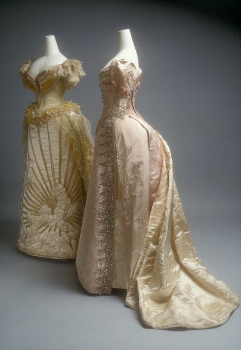 Ball gowns (c 1892) by Jean-Philippe Worth.  Metropolitan Museum of Art. Both of these evening dresses provide examples of the quality of dressmaking for which Charles Frederick Worth and the House of Worth were renowned among society women worldwide by the last quarter of the nineteenth century. Both feature lavish textiles and ornamental embroidery picked out in metallic thread and glass or crystal beads. House Of Worth Gowns, Worth Gowns, Charles Frederick Worth, House Of Worth, Victorian Dresses, 1800s Fashion, Historic Fashion, 19th Century Fashion, History Of Fashion