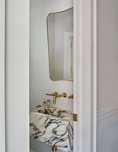 For this powder room sink, the designers earmarked a dynamic block of Calacatta Viola marble. They were so captivated, they ordered more for the ensuite. “The fabricator called to warn us about the antique-looking golden background. We love it,” says Maayan Kessler. California Bathroom, Modern Chateau, Kelly Wearstler Wallpaper, White Powder Room, Unlacquered Brass Hardware, Parisian Kitchen, Calacatta Viola Marble, Zebra Wallpaper, Viola Marble