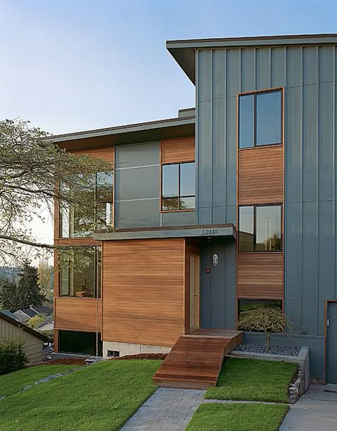 Not crazy about the slate blue.  Too light.  Combination cedar and siding.  Black windows. Modern Siding, Brick Farmhouse, Wood Siding Exterior, Split Level Remodel, Cement Panels, Siding Ideas, Modern Remodel, House Addition, Split Level House