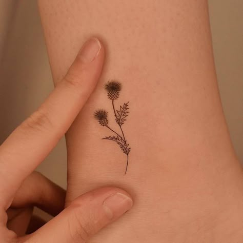 Scottish Flowers Tattoo, Thistle Outline Tattoo, Thistle Wrist Tattoo, Thistle Tattoo Meaning, Thistle Finger Tattoo, Flower Of Scotland Tattoo, Simple Scottish Tattoo, Small Thistle Tattoo Simple, Scottish Thistle Tattoos