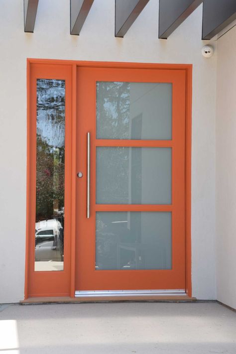 Home DIY door improvement and door idea. ‍♀️‍♂️ #homeimprovement #diydoors #diydoor #diyhome #DIY #door #doors #frontdoor #homeprojects #homeremodeling #doorremodel #doorprojects #fromtdoorprojects #moderndoors #dooridea #customdoor #customdoors Pivot Doors Entry, Mid Century Front Door, Orange Front Door, 70’s House, Narrow Window, Orange Front Doors, Front Entry Door, Modern Exterior Doors, Orange Door