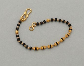 Girls Bracelet Designs Gold, Traditional Gold Bracelet For Festival, Traditional Gold Beaded Bracelets For Puja, Black Beads Bracelet Gold For Women, Black Beads Hand Bracelet Gold, Gold Jewelry With Black Beads For Puja, Latest Gold Ring Designs, Baby Jewelry Gold, Simple Necklace Designs