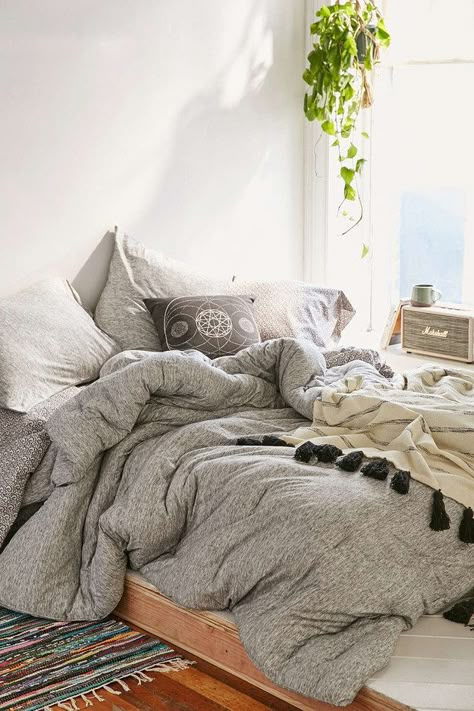 This jersey comforter that feels like a soft tee for your entire body—$169 Urban Outfitters Room, Unmade Bed, Boho Dorm Room, Boho Dorm, Decor Ikea, Blankets And Pillows, First Apartment, Cozy Bed, My New Room