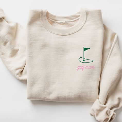 Golf Mom Sweatshirt I love to help my customers with custom orders, if you have a specific request (adding team or club name, bachelorette party personalization, a different sweatshirt color, design on a shirt, or a swap to a Comfort Colors sweatshirt), please message me and I will promptly get back to you! This is a Gildan Sweatshirt with a UNISEX FIT. Please review the size chart in the images before you place your order. If you have any questions about sizing, I would be happy to help! If you don't see the specific color that you are looking for, please message me and I will get back to you quickly. PRODUCTION and SHIPPING Production takes about 1-3 days and standard shipping is 3-5 business days. If you are in a rush, please message me and I can help with shipping upgrades. RETURNS & E Golf Team Shirts, Jesus Hoodies, Golf Sweatshirt, Life Essentials, Cute Tees, Assistant Gifts, Doctor Gift, Teacher Books, Nurse Sweatshirt