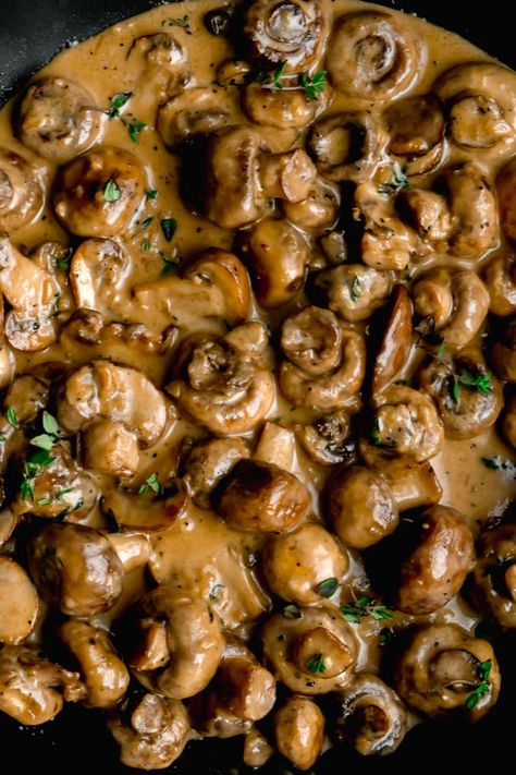 Cremini and button mushrooms sauteed in butter and garlic. Then quickly simmered in a creamy parmesan sauce until tender. The perfect topping to pork or steak off the barbecue or just eat'em all by themselves! #creamygarlicmushrooms #garlicmushrooms #sauteedgarlicmushrooms #garlicmushroomsrecipes #mushroomrecipes #garlicmushroomsauce # Mushroom Topper For Steak, Sauteed Button Mushrooms, Steak Toppers, Creamy Mushroom Steak, Cremini Mushroom Recipes, Thanksgiving Mushrooms, Mushroom Side Dish Recipes, Mushroom Side Dish, Mushrooms Sauteed