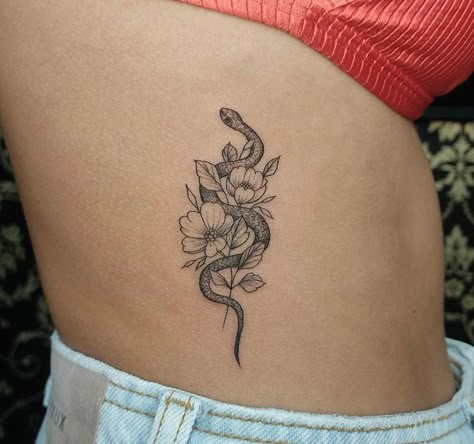 Small Snake Tattoo With Flowers, Snake Tattoos Flower, Snake Around Flower Tattoo, Rib Snake Tattoos For Women, Small Snake With Flowers Tattoo, Delicate Snake Tattoos For Women, Snake Tattoos Rib Cage, Divine Feminine Snake Tattoo, Snake And Lily Tattoo