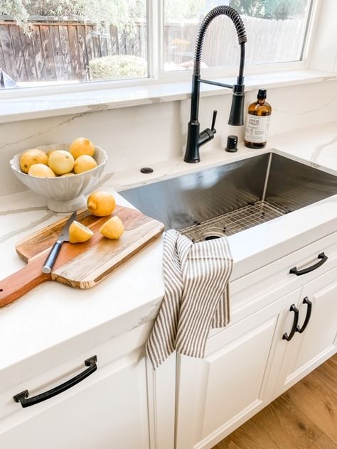 Bay Area design project. Vadara quartz counters, stainless steel sink, black industrial sink faucet, white kitchen cabinets Stainless Steel Undermount Sink Black Faucet, White Kitchen Cabinets Sink Ideas, Black Sink Stainless Appliances, Stainless Steel Sink White Countertops, Black Sink With Stainless Faucet, White Cabinet Black Fixtures, Black Kitchen Faucet Stainless Sink, Single Basin Sink Kitchen, Black Farmhouse Kitchen Faucet