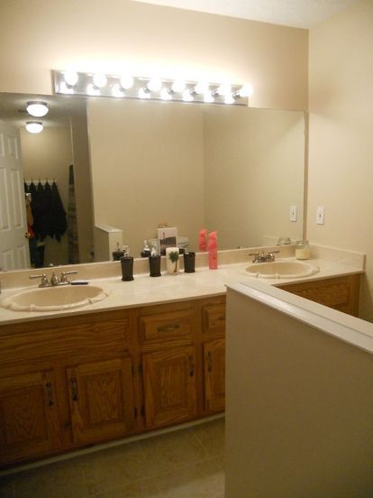 I have these awful "hollywood" style light fixtures in two of my bathrooms, but I am on a tight budget and can't afford the cost of completely replacing them. Any ideas on how to make covers for them, or any other ways to transform these without spending too much? Hollywood Lights Makeover, Shallow Sink, Diy Vanity Lights, Hollywood Vanity Lights, Light Fixture Makeover, Interior Design Mistakes, Harsh Lighting, Lighting Makeover, Cheap Bathroom Remodel