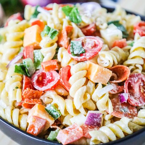 This Rotini Pasta Salad is a simple and incredibly tasty entree, side dish, or appetizer! This cold pasta salad with Italian dressing is made with tender rotini noodles tossed with pepperoni, fresh bell pepper, and cheese cubes in a creamy Italian dressing. It's an easy, healthy, 30 minute easy pasta salad recipe you'll be making again and again! Creamy Rotini Pasta Recipes, Easy Rotini Pasta Recipes, Pasta Salad With Cheese Cubes, Homemade Creamy Italian Dressing, Rotini Pasta Recipes, Pasta Salad With Italian Dressing, Rotini Pasta Salad, Lemon Vinaigrette Dressing, Vinaigrette Dressing Recipe