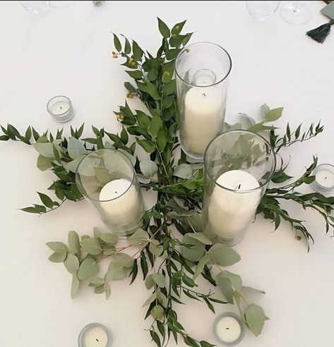 Cylinder vases with a simple bed of fresh ruscus and eucalyptus. Botanical Wedding Decor, Grad 2025, Eucalyptus Centerpiece, Botanical Center, Olive Wedding, Wedding Timeless, Events Center, Circle Table, Pioneer School