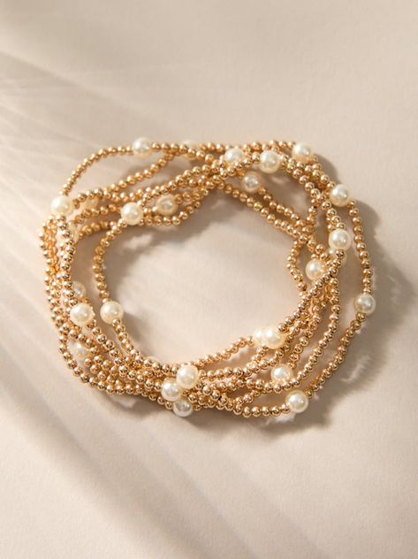 Stacking jewelry is a trend that will never go away, add to your bracelet collection with this set of gold and pearl stretch bracelets. Wear them together or pick and choose how many, these bracelets are dainty in design so they are cute on their own or powerful all together. Cheap Dainty Pearl Bracelet With Round Beads, Cheap Pearl White Pearl Bracelet With Round Beads, Jewelry Cuff Bracelet, Bracelet Telephone Nude, Gold Bracelet For Women Modern, Trendy Small Beaded Bracelets, Preppy Bracelets Pearl, Roller Rabbit Bracelet, Dainty Bracelets Simple & Dainty Jewelry