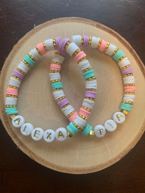 Named Beaded Bracelets, Beaded Bracelets Heishi, Clay Polymer Bead Bracelets, How To Make Bracelets With Flat Beads, Bracelets Colors Ideas Beads, Flat Bead Bracelet Color Combos, Clay Bead Bracelet Ideas Name, Purple Heishi Bracelet Ideas, Clay Bead Bracelet Business Name Ideas