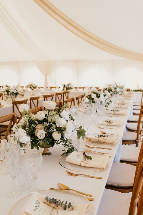 Banquet tables complete with white tablecloths, white floral arrangements and gold cutlery finished with fabric napkins tied with brown string Wedding Table Champagne Color, Beige Wedding Theme Table Settings, Wedding White And Beige, Brown Table Wedding Decor, Wedding Table White Tablecloth, Wedding Table Dressing, Wedding Banquet Table Decorations, Engagement Table Set Up, White Linen Wedding Table