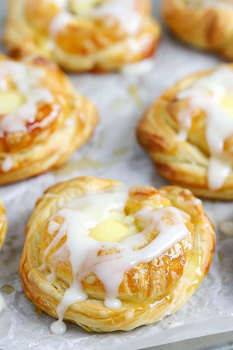 Cream Cheese Danish, flaky and buttery, are surprisingly easy to prepare with frozen puff pastry sheets! No need for professional pastry chef skills to whip up these delightful treats, ideal for breakfast, brunch, or a snack. Just seven ingredients and a bit of your time can yield bakery-quality Cheese Danish right from your own kitchen. Frozen Puff Pastry Recipes, Homemade Cheese Danish Recipe, Cherry Cheese Danish Recipe, Recipes Using Puff Pastry, Breakfast Danish, Cream Cheese Puffs, Easy Puff Pastry Recipe, Cream Cheese Breakfast, Cream Cheese Puff Pastry