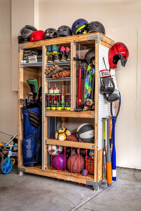 Tired of organizing and taking out sports equipment for weekly practice. Storing sports equipment can feel a bit overwhelming, but luckily we have the perfect solution to keep all your equipment in one place. Our DIY Sports Equipment Organizer provides ample storage with separate compartments and shelves to keep everything neatly organized. Build it today following our guided step-by-step free downloadable plan on our blog Sports Equipment Organization, Garage Hacks, Sports Equipment Storage, Connecticut House, Garage Storage Inspiration, Gear Room, Sports Storage, Garage Organizing, Garage Organisation