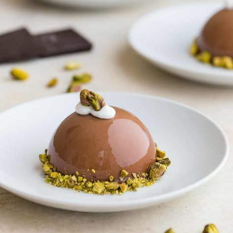 This Chocolate Pistachio Dome with Almond and Pistachio Nougatine is inspired by the elegant Chocolate Journeys dessert served onboard Princess Cruises. Dome Desserts, Zumbo Desserts, Chocolate Dome, Baileys Cheesecake, Fancy Desserts Recipes, Chocolate Pistachio, Mousse Cakes, Mousse Dessert, Elegant Desserts