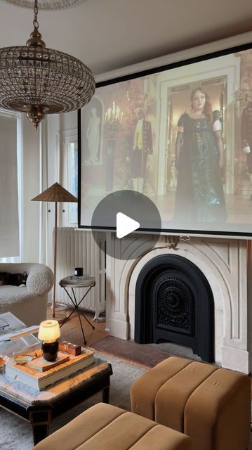 Mallory Fletchall | Reserve Home on Instagram: "On repeat 🫡 what do we think of season 3 so far? We installed an additional projector screen downstairs so we can move our portable projector around to watch wherever is most comfy in the moment. 10/10 recommend.⁣
⁣
⁣
⁣
⁣
#homedecor #interiordesign #diyhome #bridgerton #cozyvlog cozy home, cozy room, nyc apartment, parisian style, parisian vibes, living room design, home decor, living room decor, apartment decor, vintage home, day in the life, vlog" Projector Screen Ideas Living Rooms, Pull Down Projector Screen Living Room, Projector Tv Living Room, Projector In Living Room Ideas, Projector Living Room Ideas, Living Room Projector Setup, Projector In Living Room, Hidden Projector Screen, Projector Screen Living Room