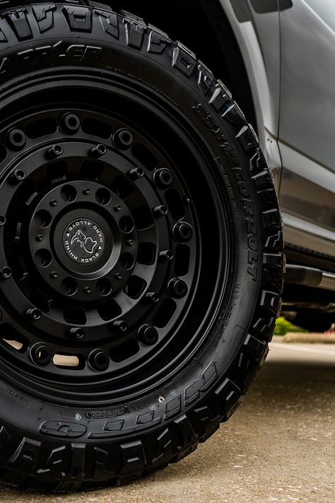 This 2020 Ford F150 XLT took a dip in our paint department to receive a matching set of painted lead foot mirror caps, grille inserts, and magnetic metallic badges. We fitted it with a 2-inch lift kit, 20-inch Black Rhino Arsenal wheels, and Nitto Ridge Grappler tires. We finished it off with a spray-in bed liner and UltraFlex Tonneau Cover, making this build a match made in heaven for any F150 enthusiast. Black Ford F150, Ford F150 Interior, Truck Rims And Tires, 2020 Ford F150, F150 Accessories, Ford F150 Lariat, Black Rhino Wheels, Nitto Ridge Grappler, Truck Life