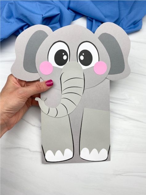 How cute is this! Make your own elephant paper bag puppet craft with our free template. This craft would be perfect for preschool and kindergarten children to use in zoo animal units. Recycled Animals, Elephant Puppet, Elephant Craft, Puppet Template, Elephant Template, Zoo Animal Crafts, Bag Puppet, Circus Crafts, Elephant Crafts