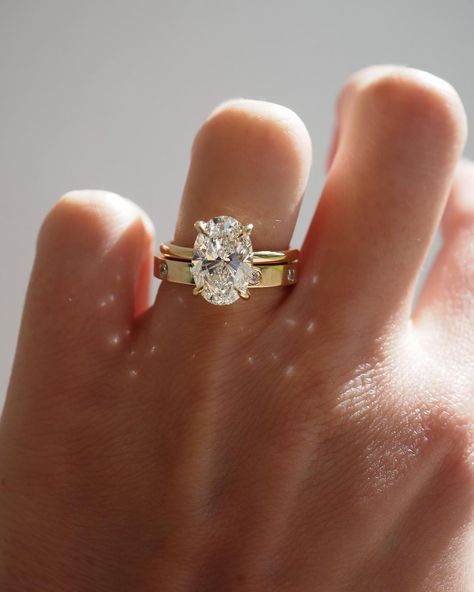 Kate & Kole | The perfect pairing — Our Clara 3.09ct Oval Solitaire Engagement Ring paired perfectly alongside our newest addition to our Wedding Band… | Instagram Thick Gold Wedding Band, Thick Band Engagement Ring, Gold Oval Engagement Ring, Thick Wedding Bands, Gold Band Engagement Rings, Elegant Wedding Rings, Dream Wedding Ring, Oval Solitaire Engagement Ring, Stacked Wedding Bands