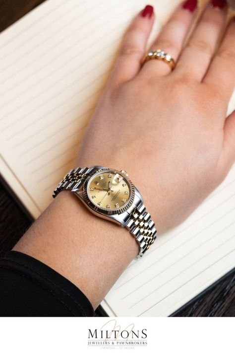 This midsize Rolex Datejust has a 31mm steel watch casing with a yellow gold fluted bezel. The watch casing is water-resistant up to 100m and comes fitted with a steel and gold Rolex Jubilee bracelet. This watch has a champagne coloured dial with diamond hour markers and a date aperture at the 3 o'clock position. Rolex Datejust Women, Rolex Jubilee, Rolex Watches Women, Gold Rolex, Wrist Jewelry, Bridal Bangles, 100m, Rolex Datejust, Steel Watch