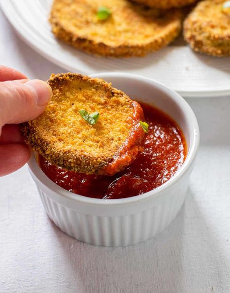 Make these Baked Breaded Eggplant Slices for a delicious appetizer, side dish or to use in recipes like Eggplant Parmigiana! You'll love this method for crispy eggplant "fried" without much oil! Romano cheese brings a nice pop of flavor. #breadedeggplant #bakedbreadedeggplant #eggplantslices Oven Fried Eggplant, Eggplant Fried, Eggplant Baked, Baked Eggplant Slices, Gameday Snacks, Breaded Eggplant, Eggplant Appetizer, Italian Thanksgiving, Cauliflower Chowder