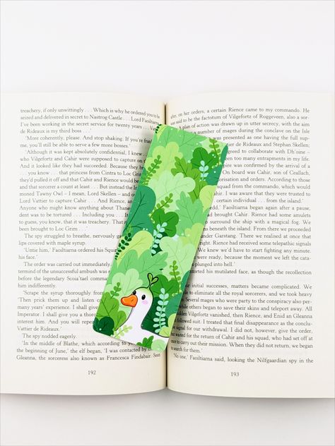 Double sided laminated handmade bookmark. A kawaii white duck standing in a leafy green forest. He has a little green sprout coming out of the top of his head. Duck Bookmark, Bookmark Inspiration, Sprout Bookmark, Nature Bookmark, Kawaii Cottagecore, Cottagecore Gifts, Nature Bookmarks, Bookmark Handmade, Creative Bookmarks