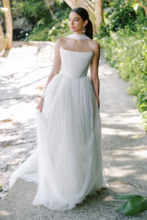 Watters Style #67411B. 
                        Introducing Reko, a wedding dress that reimagines the classic ballgown. The soft net tie and Georgian-style corsetry adds a touch of romance and structure, resulting in a creation that's as unique as it is elegant. Crafted from soft netting, this gown embodies contemporary style while paying homage to the timeless charm of a ballgown silhouette. The dainty and delicate tucks add an element of intrigue. These tucks are a nod to modern design sensibilities, adding a touch of uniqueness to the classic ballgown shape.
                    <div class="expandable-block-overlay" style="display: block; width: 100%; height: 36.431999px; position: absolute; bottom: 0px; right: 0px; transition: max-width 1s ease 0s; background-image: linear-gradient(to r Classic Timeless Wedding Dress, Watters Wedding Dress, Full Gown, Boho Princess, Corset Gown, Ethereal Wedding, Bridal Robe, Bride Groom Dress, Designer Wedding Gowns