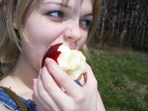 On earth eating my apples Eating Fruit Reference, Eating Fruit Photoshoot, Person Eating Apple, Eating Apple Reference, Adams Apple Aesthetic, Woman Eating Apple, Eating Pose Reference, Apple Girl Aesthetic, Apples Aesthetic