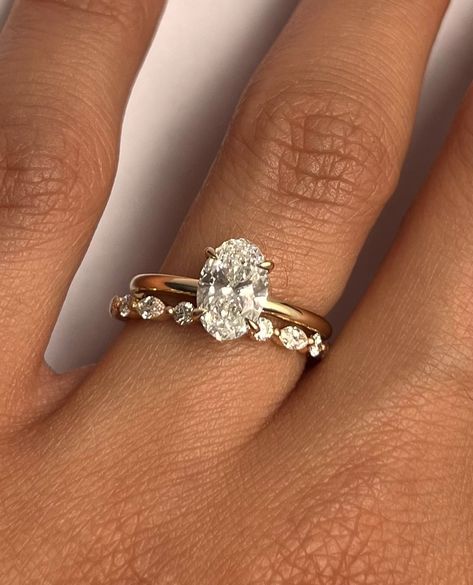 Aviva Ring with oval cut diamond paired with our Bella band Build your classic stack with us 💍 • • #engagementring #finejewelry #ringstack #bridal #diamond #weddingband #shesaidyes #ringinspiration Criss Cross Wedding Band With Oval Engagement Ring, Gold Wedding Band Oval Engagement Ring, Wedding Bands For Oval Engagement Ring, Gold Oval Engagement Ring With Wedding Band, Oval Ring With Wedding Band Gold, Engagement Wedding Ring Combo, Wedding Ring Stack Oval Engagement, Oval Wedding Ring And Band, Oval Cut Engagement Ring Stack