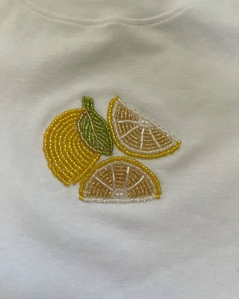 Beaded T-shirts 🤌🏻🫀 Embroidery Designs In T Shirt, Creative Handmade Things, Lemon Bead Embroidery, Tee Shirt Embroidery, Embroidery Patterns For Shirts, Creative T Shirts, Beading Projects On Fabric, Beaded Shirt Embroidery, Embroider Shirt Ideas