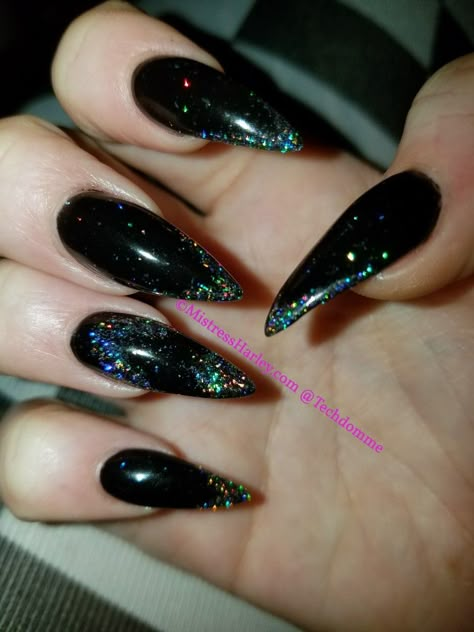 Dark Stilleto Nails Design, Black Hologram Nails, Black Glitter Stiletto Nails, Black Stiletto Nails With Rhinestones, Black Acrylic Nails Stiletto, Short Black Stiletto Nails, Black Stilleto Nails Designs, Black Holo Nails, Black Iridescent Nails