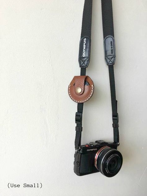 Leather Camera Lens Cap Holder Lens Cap Holder | Etsy Leather Working Projects, Diy En Cuir, Cap Holder, Leather Camera Strap, Lens Caps, Leather Camera Bag, Leather Scraps, Camera Straps, Initial Name