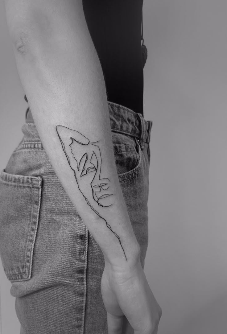 a person with a tattoo on their arm