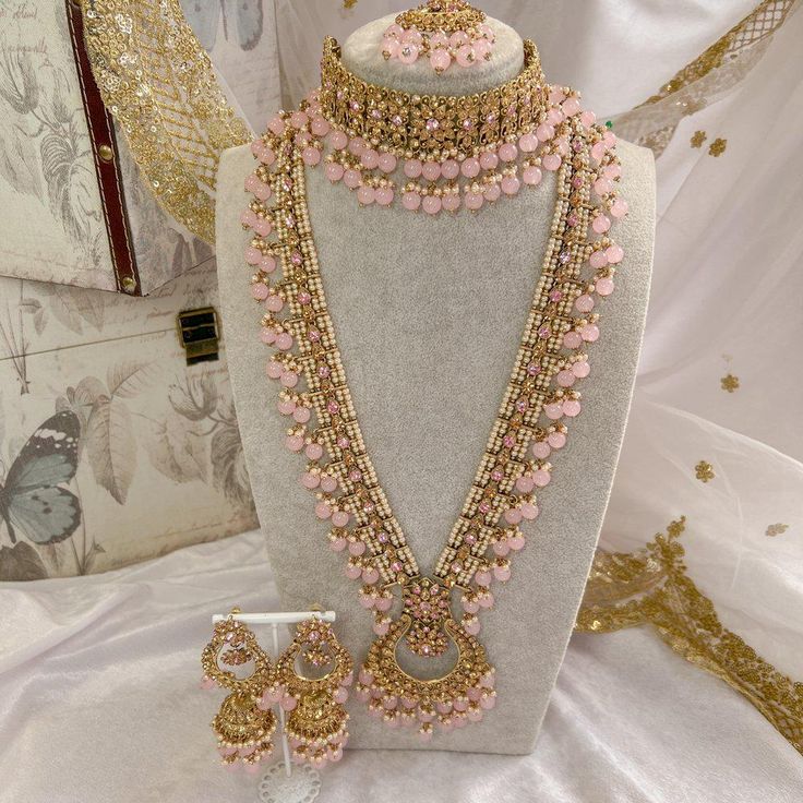 Luxurious Antique Gold Bridal set in choker style, with long mala, long jhumka earrings and tikka. Made up of of golden crystals, thousands of tiny pearls and pink glass beads. This set is ready to ship as seen with gift box. Desi Necklace, Long Jhumka Earrings, Long Jhumka, Gold Bridal Set, Green Clutches, Bridal Choker, Bridal Necklace Set, Choli Designs, Stacked Bangles