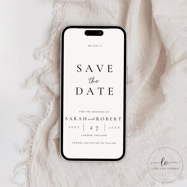 an iphone case with the save the date on it next to a white blanket and a pair of scissors