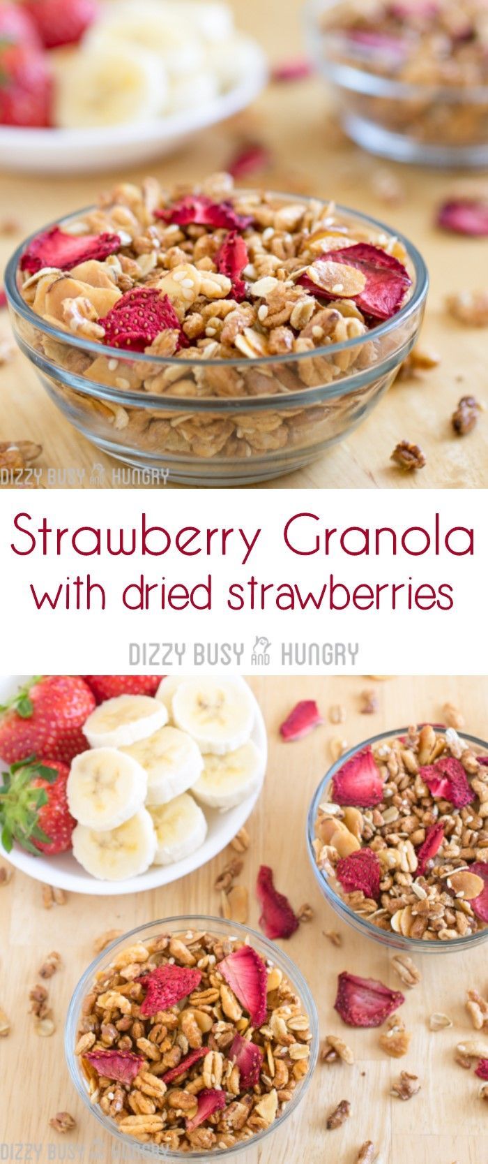 strawberry granola with dried strawberries and sliced bananas in bowls on a wooden table