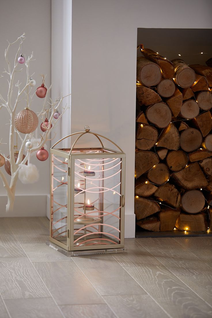 a candle holder next to a christmas tree