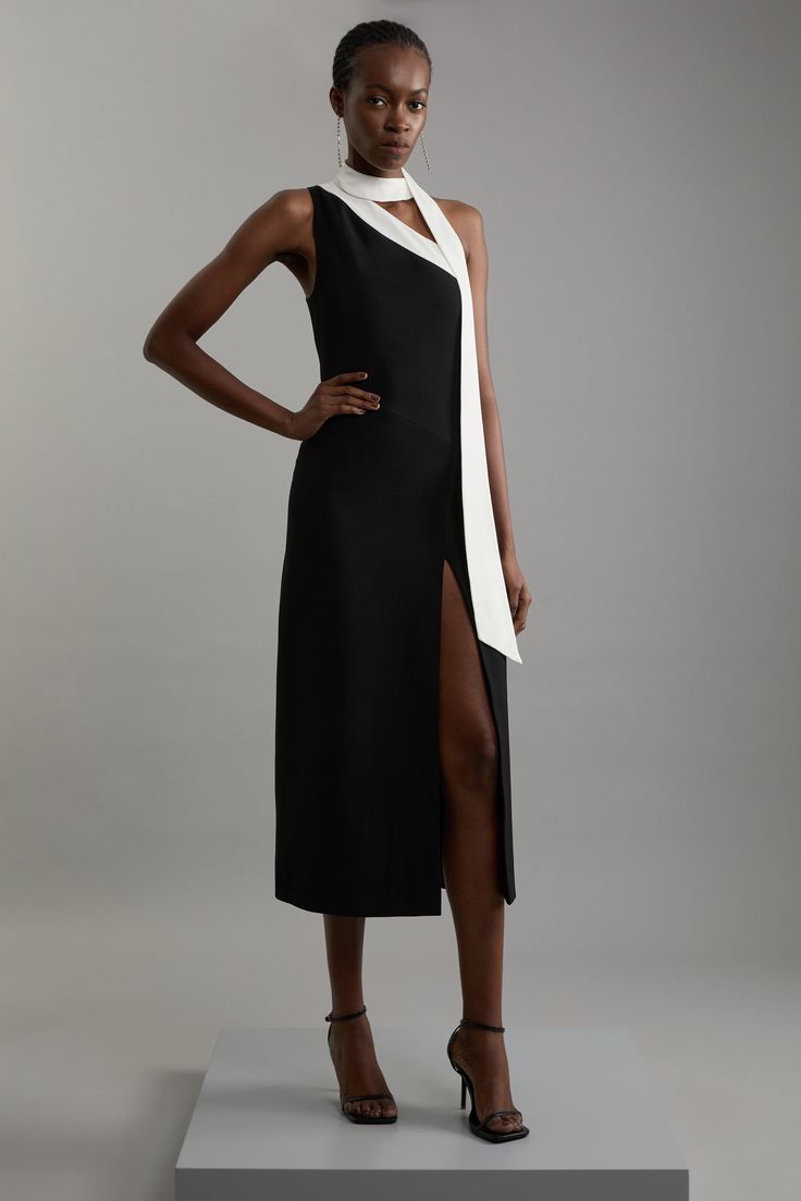 Embrace Elegance In Our Asymmetric Midi Dress, Designed With A One-Shoulder Silhouette And Thigh-High Split. The Unique Shoulder Tie Offers Versatility, Allowing You To Drape It Gracefully Around Your Neck Or Shoulders, Or Tie It Into A Statement Bow. Complete Your Look With Strappy Heels And A Clutch To Make It The Perfect Outfit For A Special Occasion Or A Romantic Date Night. Soft Tailored Asymmetric Midi Dress One Shoulder With Tie Detail Thigh High Split Flattering Soft Tailored Fit Midi Le Asymmetrical Outfit, Asymmetrical Dresses, Soft Tailoring, Romantic Date Night, Dress One Shoulder, Nice Clothes, Tailored Dress, Karen Millen, Business Outfits