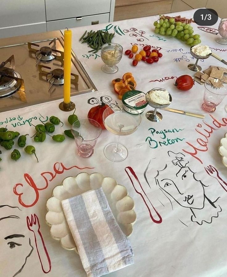 a table topped with plates and glasses filled with food