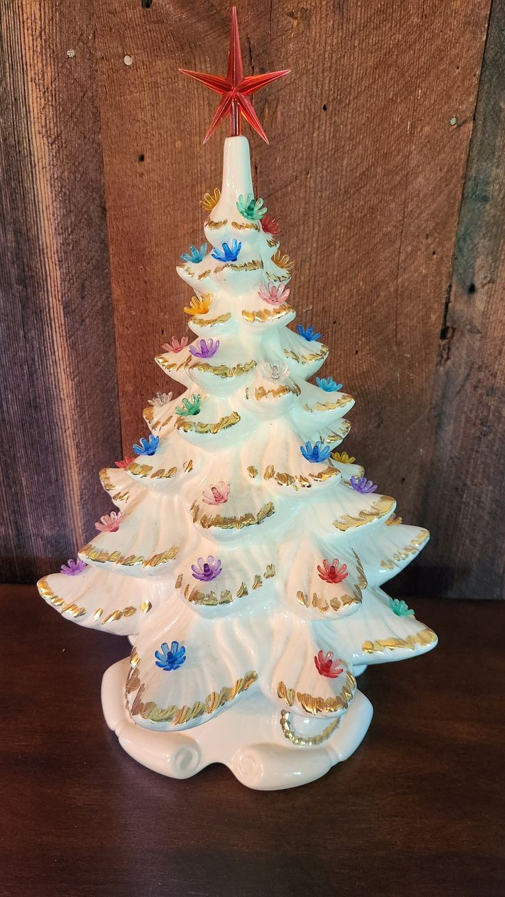 a ceramic christmas tree on a wooden table