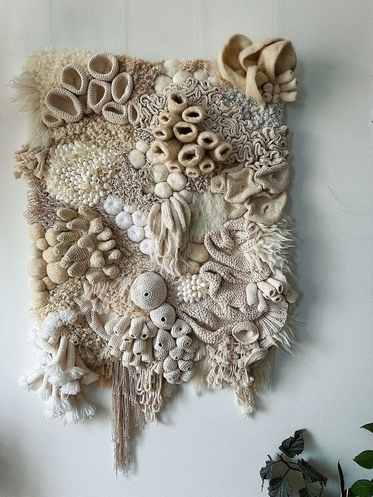 a wall hanging made out of various objects