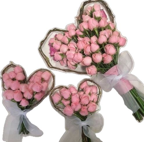 three bouquets of pink roses are in the shape of hearts