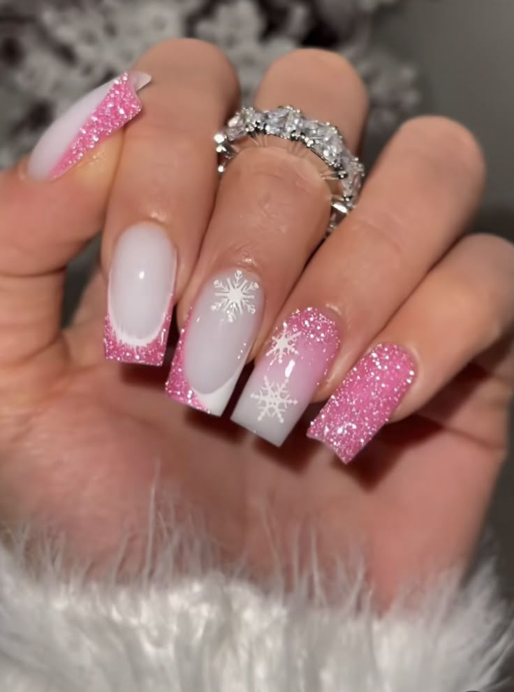 a woman's hand with pink and white nail polish