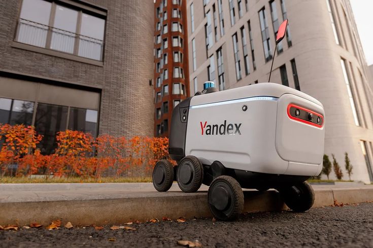 an electric vehicle is parked on the side of the road in front of a building