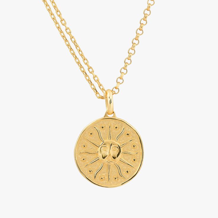 An isolated image of the 18K Gold Vermeil Sun Necklace showcasing the detailed sun face and rays design on the circular pendant, suspended on a fine gold chain. Gold Sun Necklace, Dangle Cross Earrings, Necklace Sun, Radiant Beauty, Face Pendant, Face Necklace, Sun Face, Sun Necklace, Sun Pendant