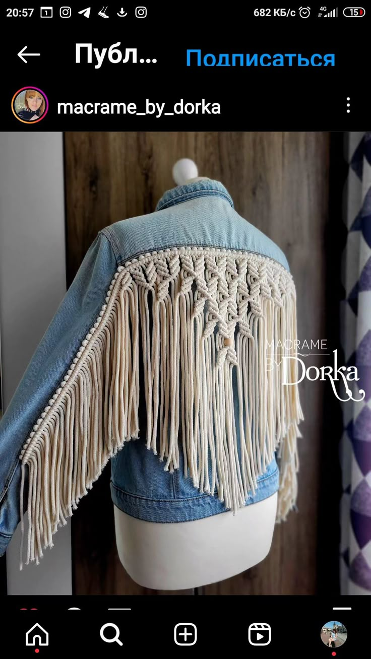 a denim jacket with fringes on it and the words macrame by dokka