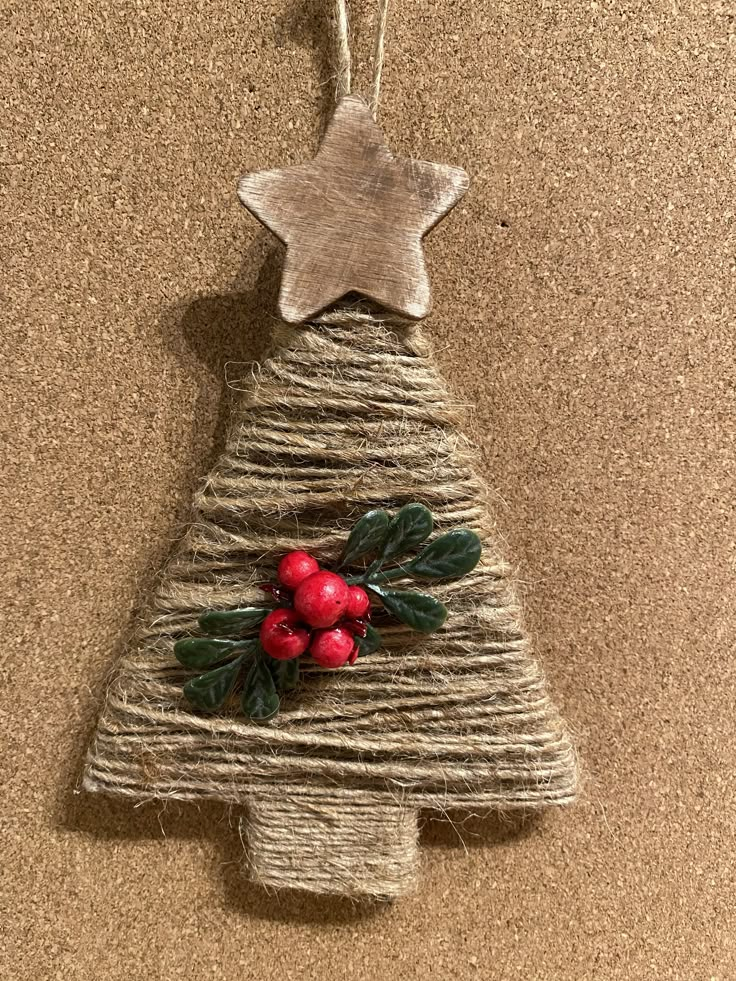 a wooden christmas tree decoration hanging on a wall