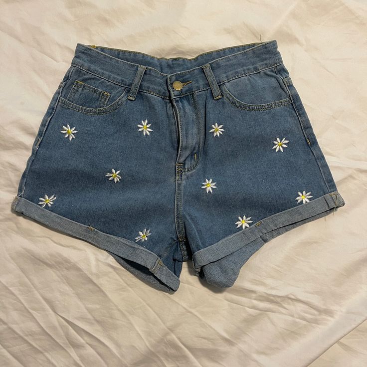 Never Worn Shein Daisy Shorts. Waist Measures ~13.5” Flat. All Flowers Are Embroidered, No Design On Back. Embroidery On Jean Shorts, High Waist Denim Blue Bottoms With Floral Embroidery, High-waist Denim Blue Bottoms With Floral Embroidery, High Waist Floral Embroidered Jeans For Summer, Trendy Denim Blue Bottoms With Floral Embroidery, Trendy Floral Embroidered Denim Blue Bottoms, Casual High Rise Bottoms With Floral Embroidery, Casual Denim Blue Bottoms With Floral Embroidery, High Rise Summer Bottoms With Floral Embroidery