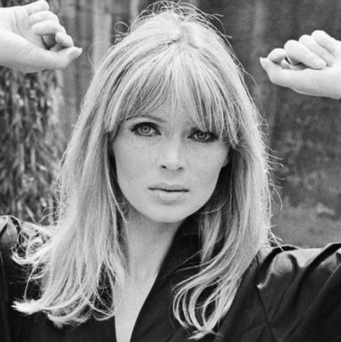 a black and white photo of a woman with long hair